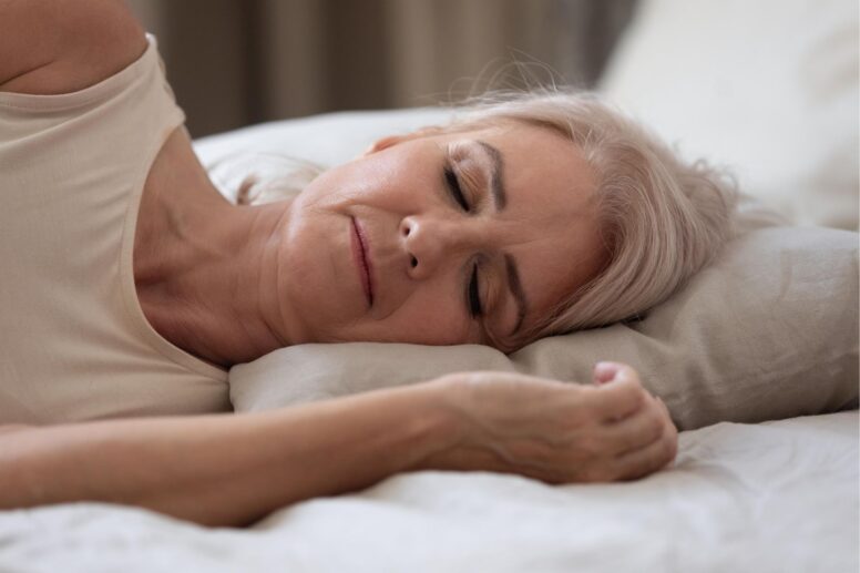 woman sleeping with herbs and supplements for insomnia